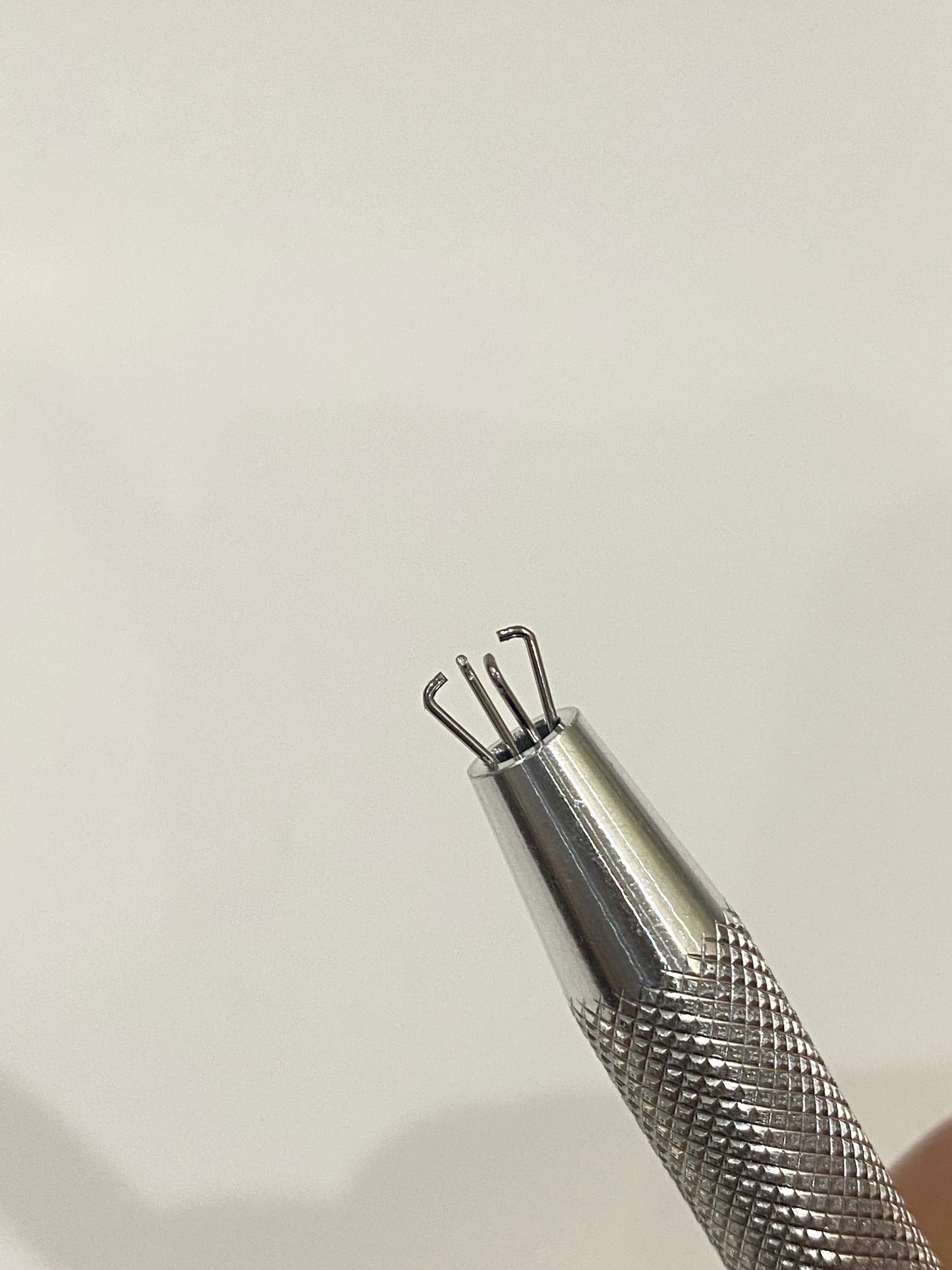 Piercing ball grabber tool