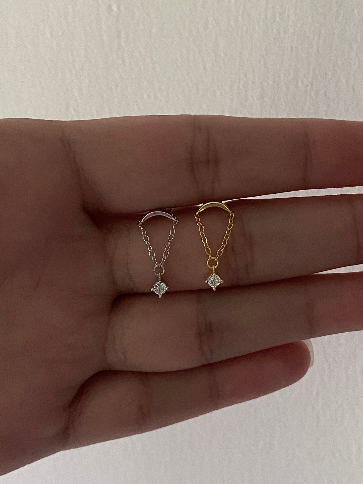 Chained zircon dangling stud