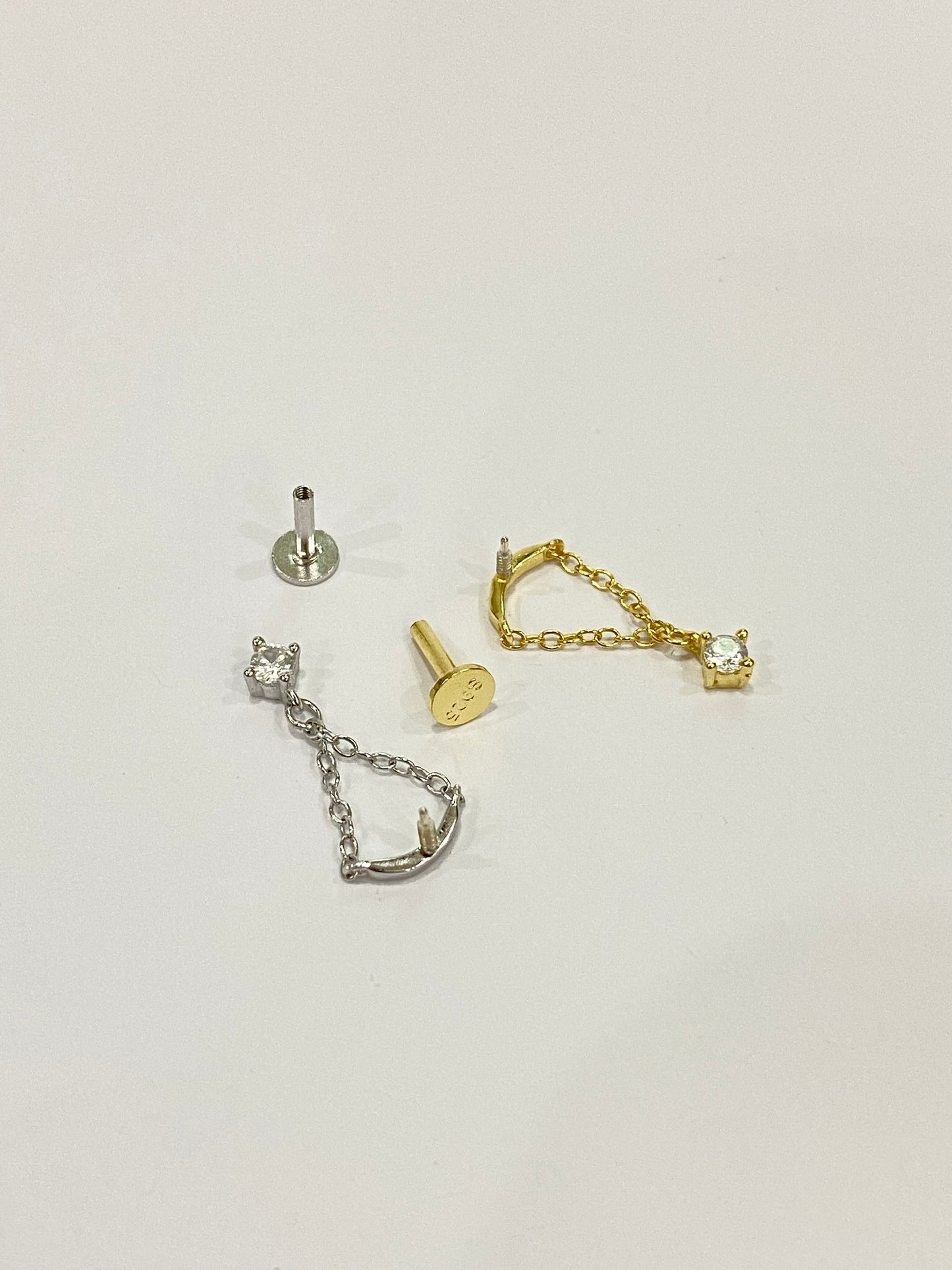 Chained zircon dangling stud