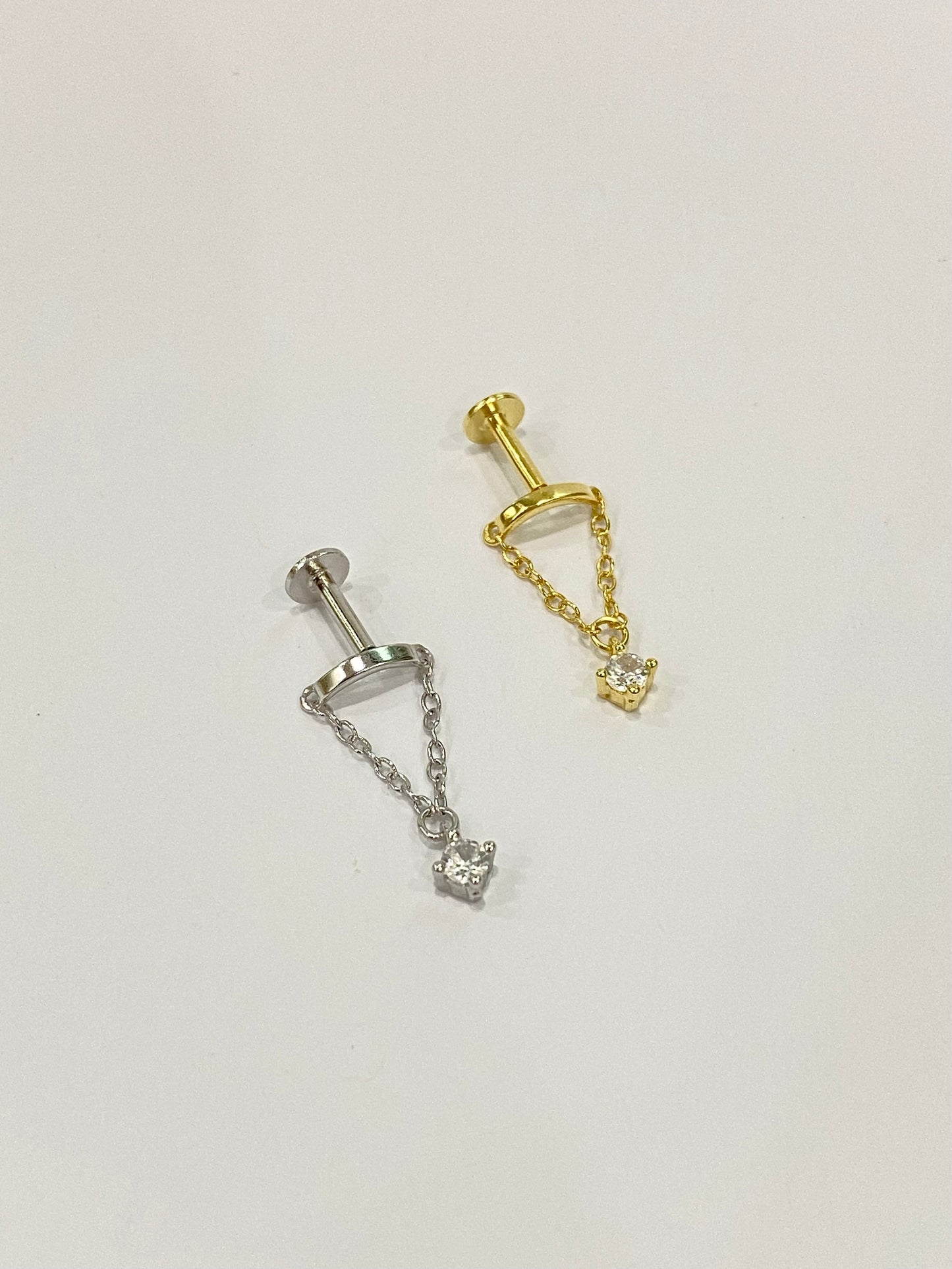 Chained zircon dangling stud