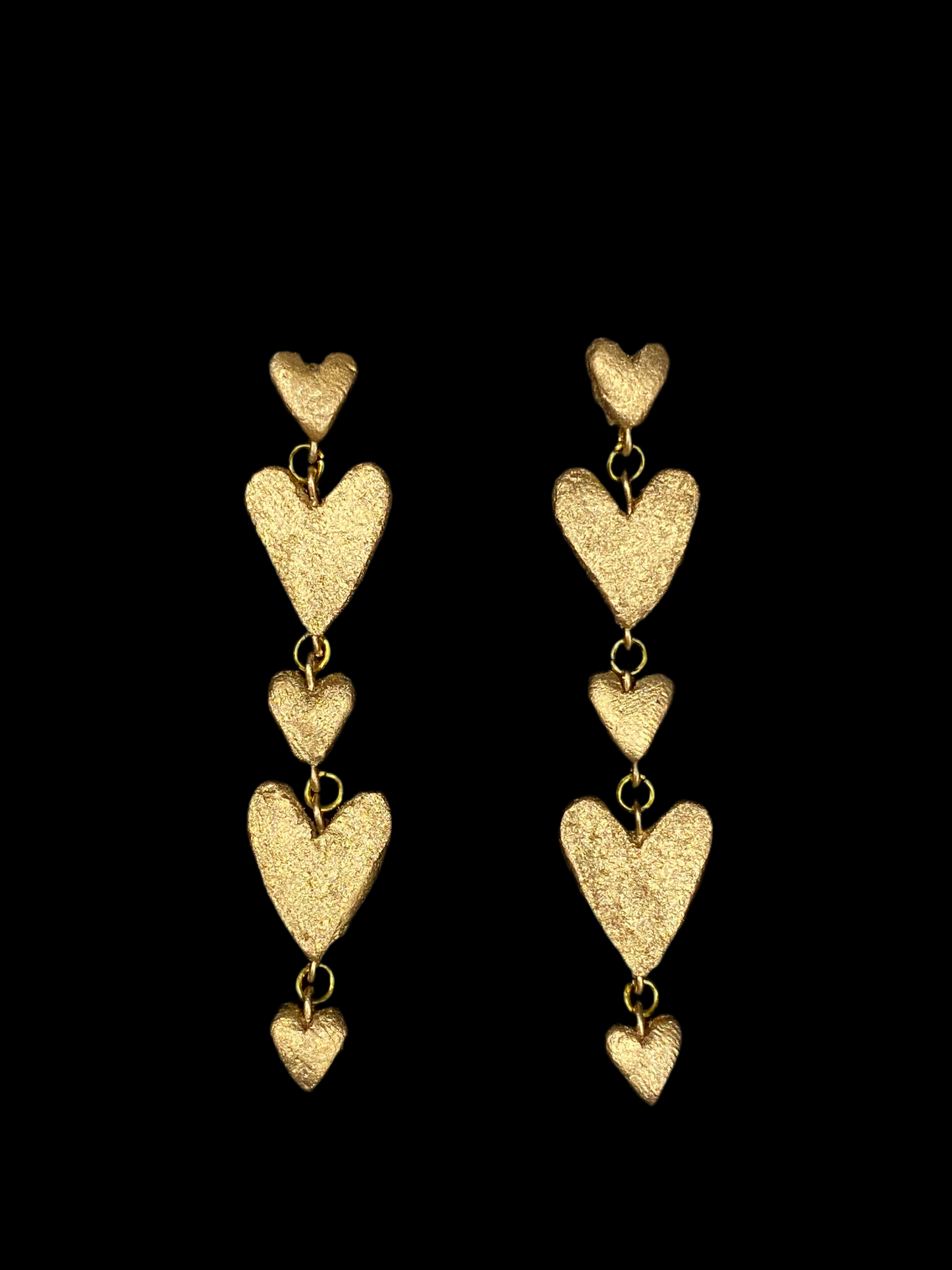 Six dangling heart earrings